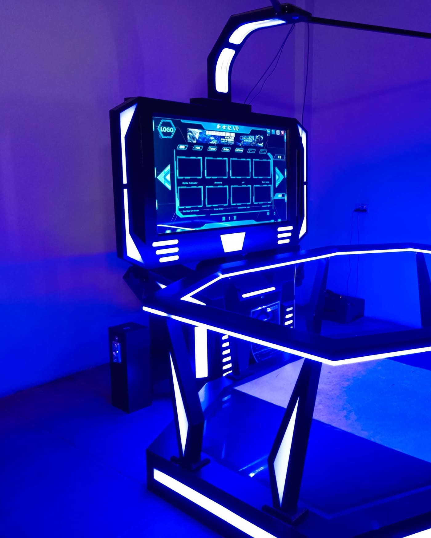 VR gaming rig with a hexagonal frame and screen lit by deep blue LED light
