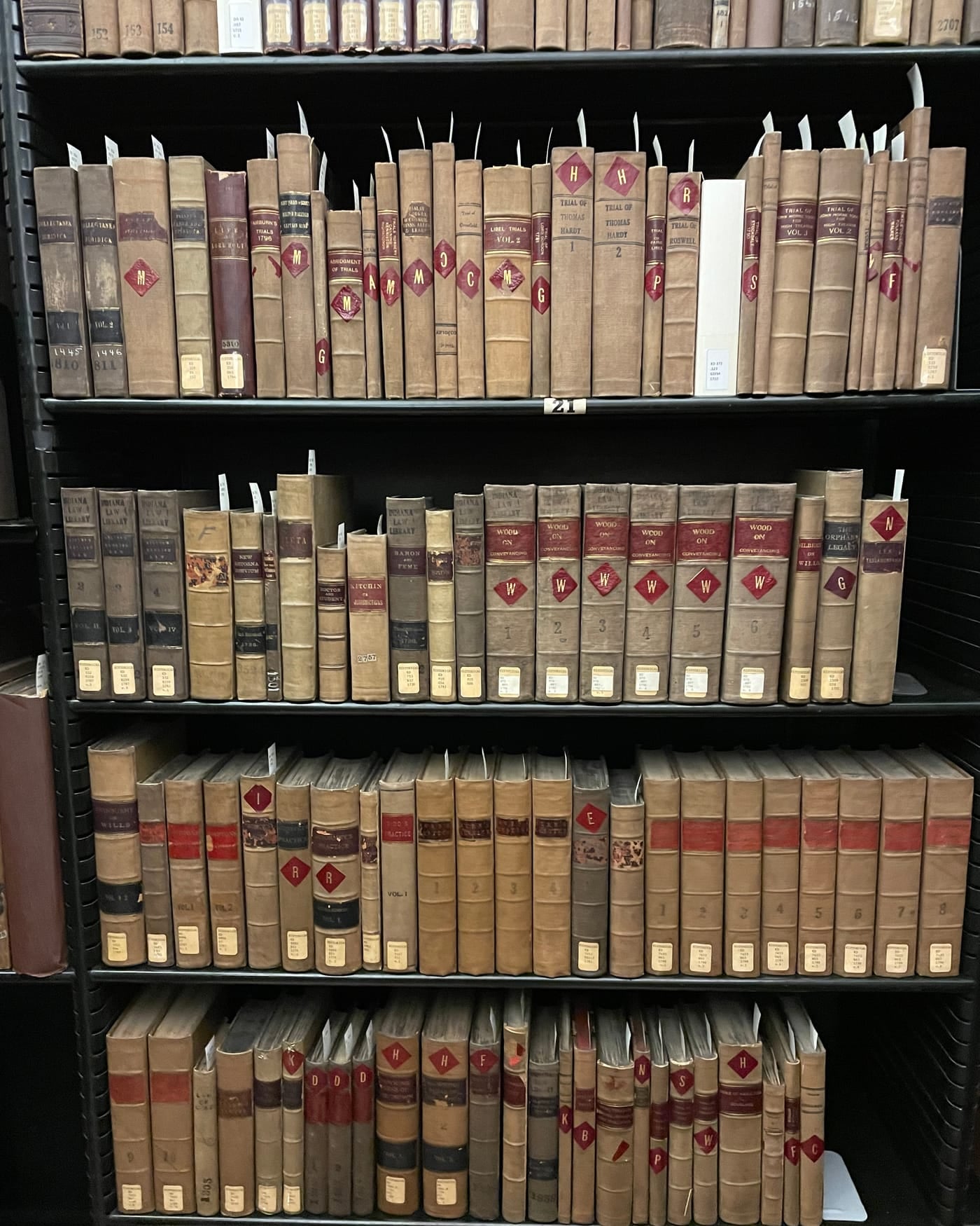 Shelves of old leather-bound law books in a library