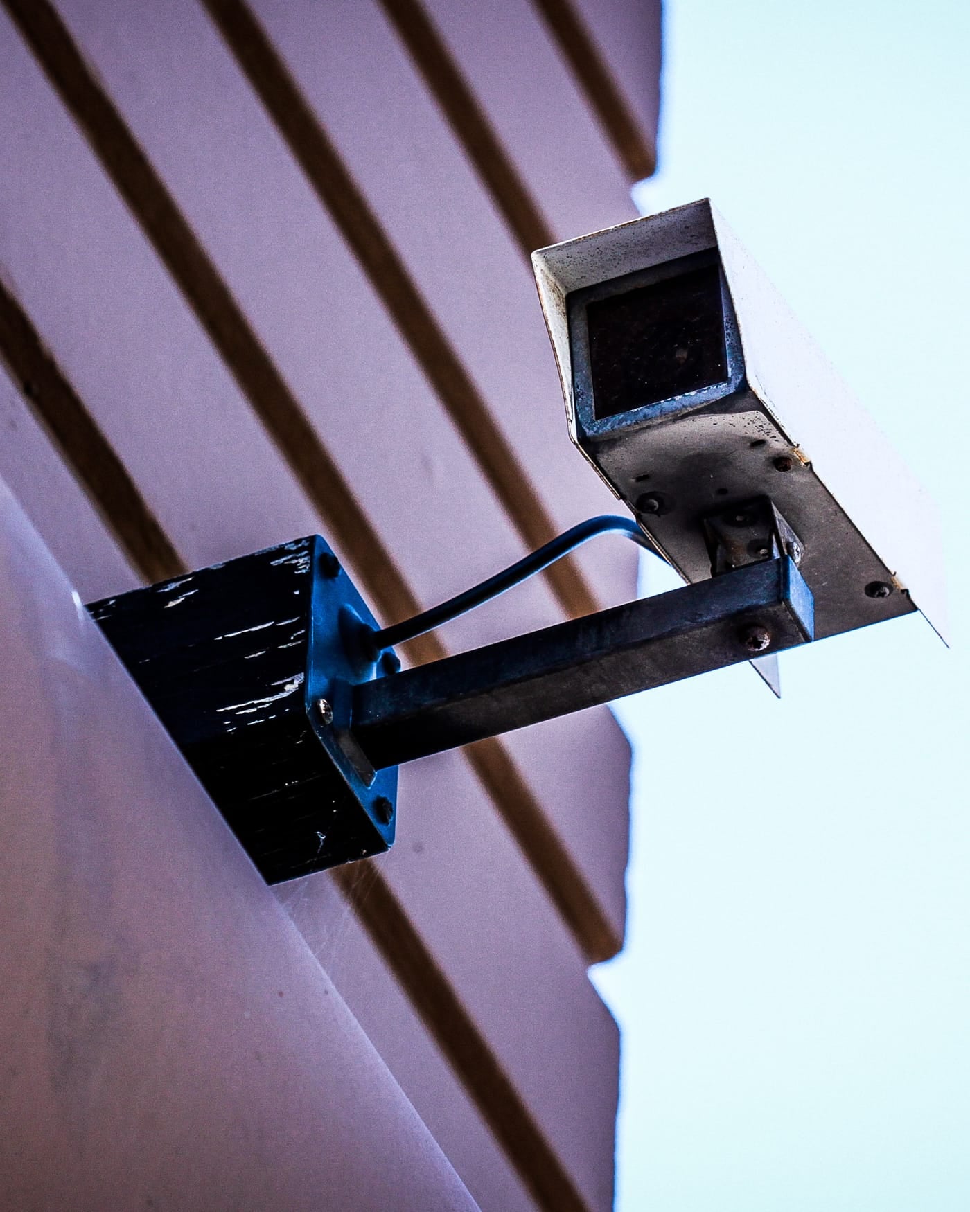 Security camera mounted on the corner of a modern building